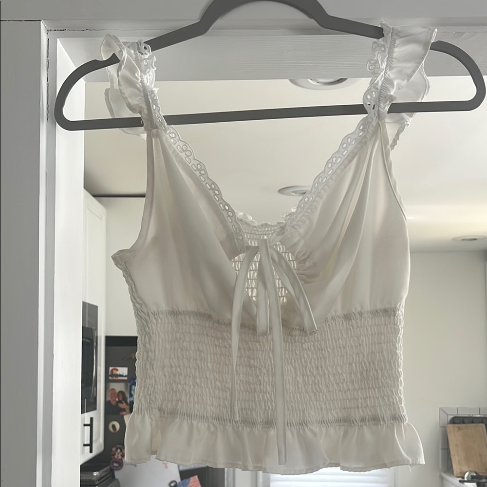 Chic White Sleeveless Top with Lace Details